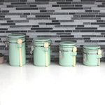 Load image into Gallery viewer, Home Basics 4 Piece Ceramic Canisters with Easy Open Air-Tight Clamp Top Lid and Wooden Spoons, Mint $20.00 EACH, CASE PACK OF 2
