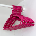 Load image into Gallery viewer, Home Basics Tubular Plastic Hanger with Concave Sides and Center Accessory Hook, (Pack of 10), Fuchsia $5.00 EACH, CASE PACK OF 12
