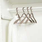 Load image into Gallery viewer, Home Basics Plastic Hangers, (Pack of 4), Timber Taupe $5 EACH, CASE PACK OF 12
