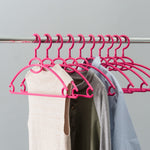 Load image into Gallery viewer, Home Basics Tubular Plastic Hanger with Concave Sides and Center Accessory Hook, (Pack of 10), Fuchsia $5.00 EACH, CASE PACK OF 12
